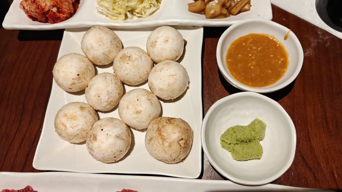 Steamed dumplings with dipping sauces