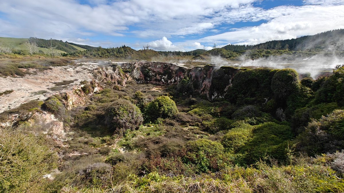 Steaming rock face and clinging scrub