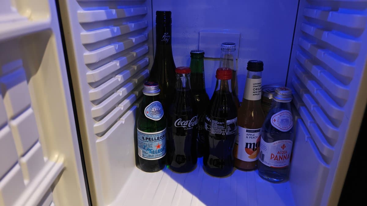 Stocked minibar fridge with drinks