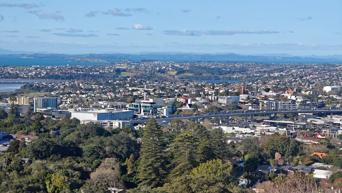 Suburbs stretching to the harbour