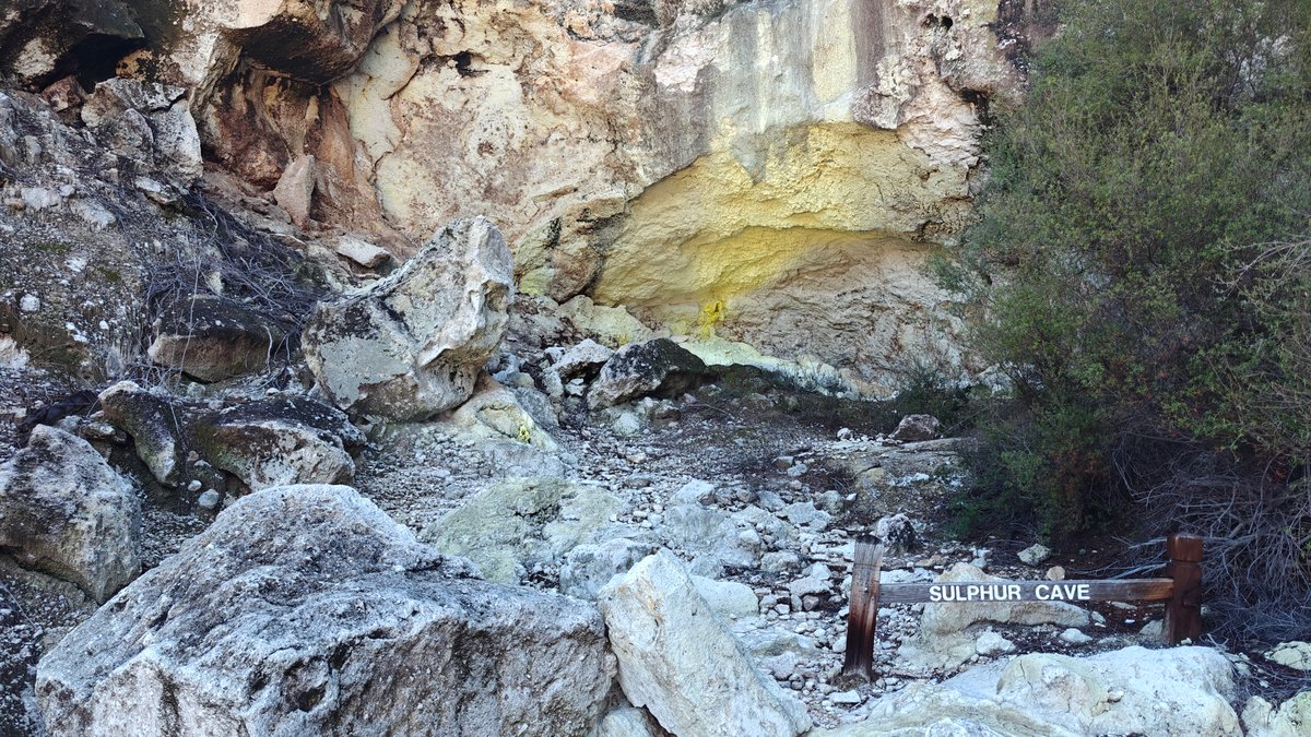 Sulphur-stained cliff and boulders