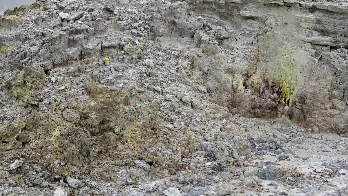 Sulphur-stained steaming rock face
