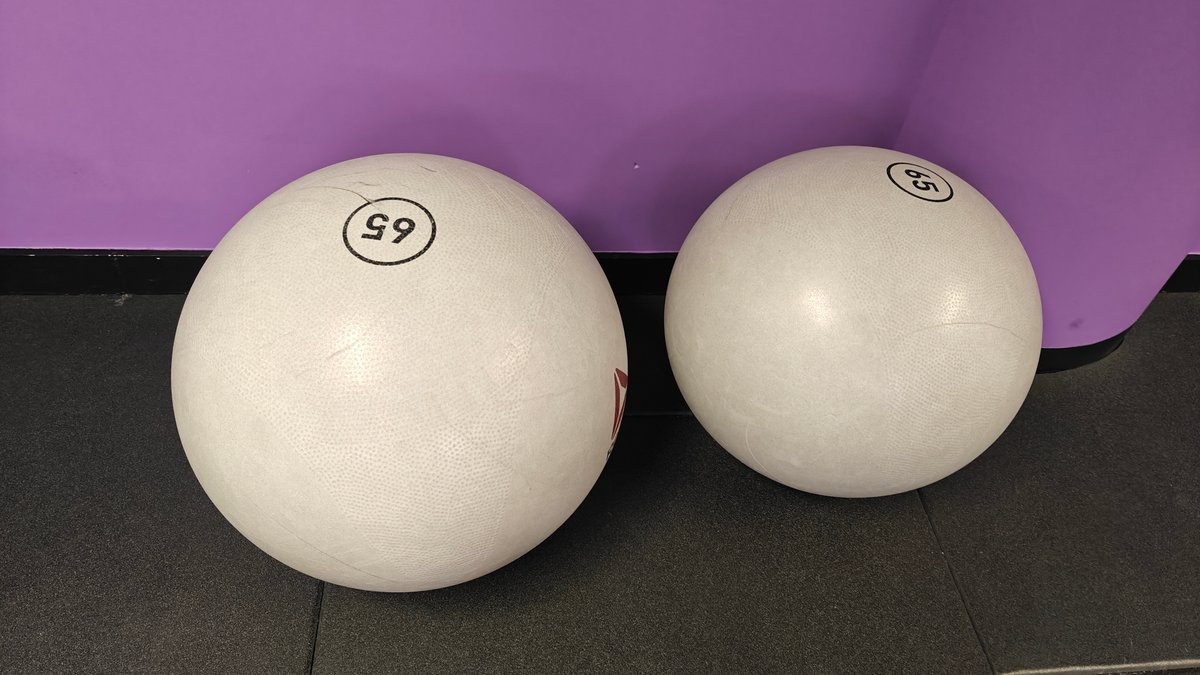 Swiss balls against the purple wall