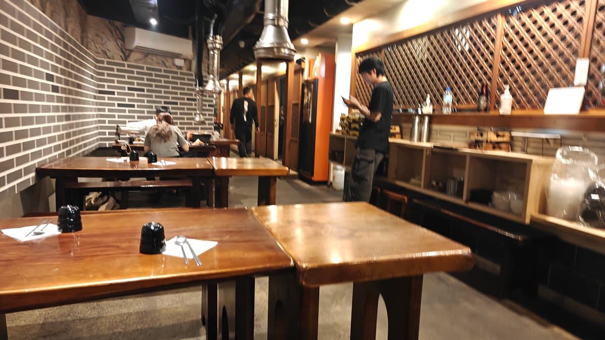Tables with recessed charcoal grills