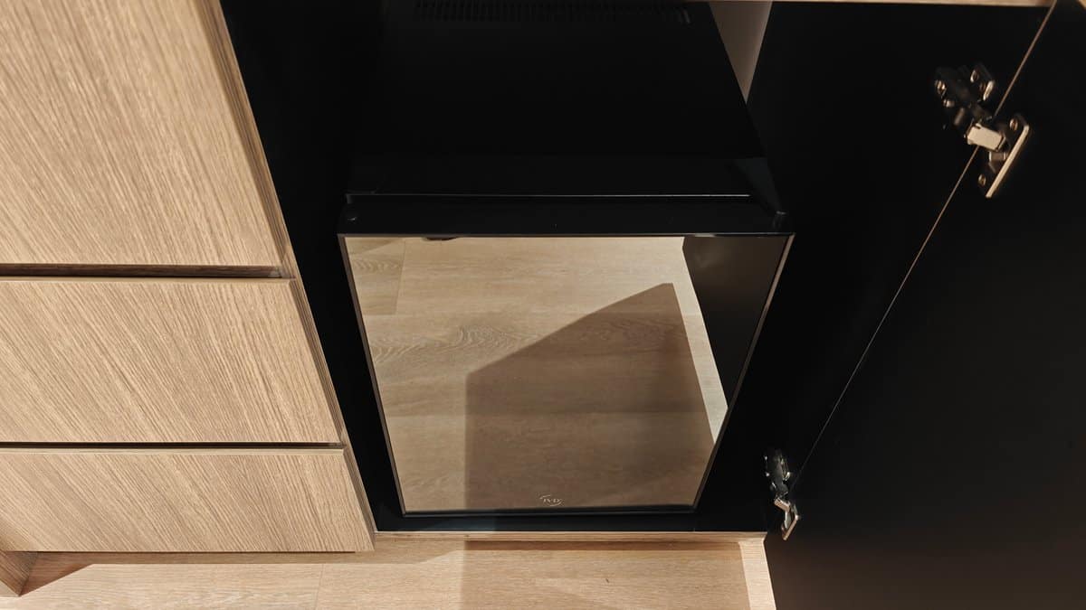 The cabinet below the counter open to the