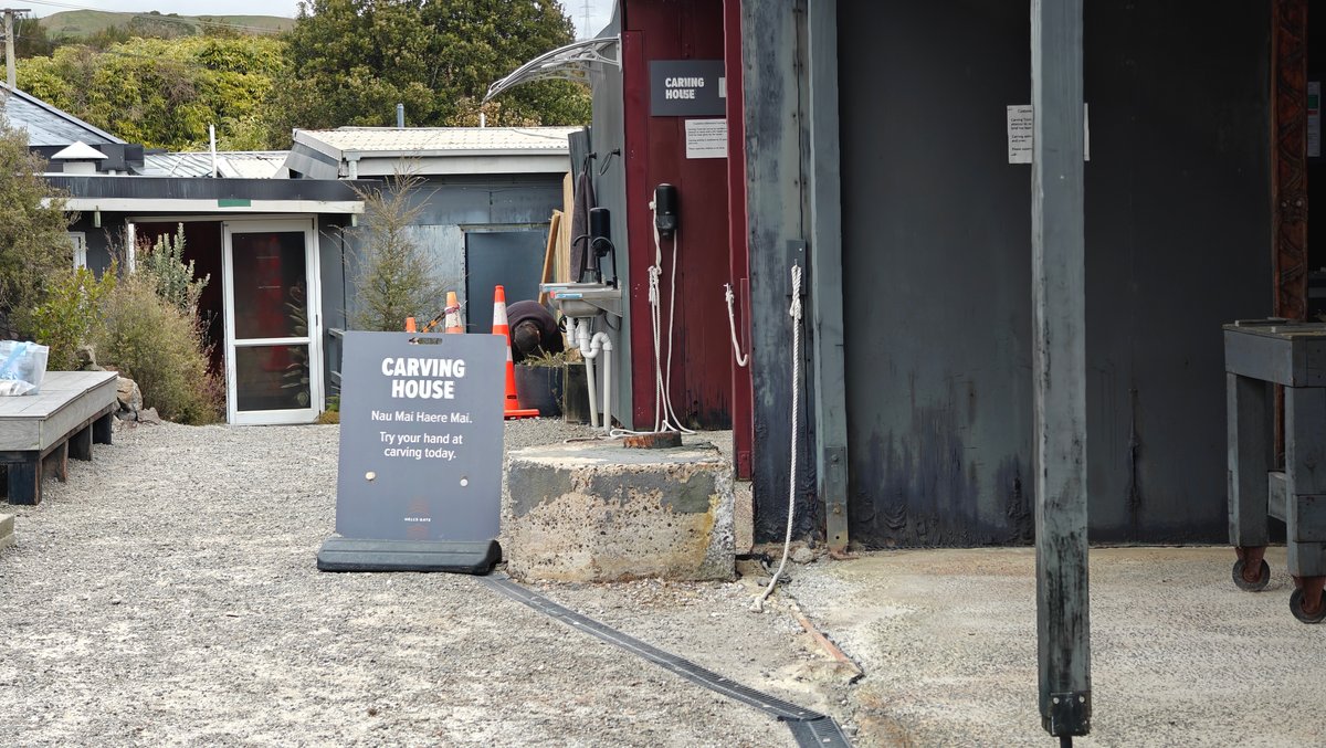 The carving house from outside, a red door