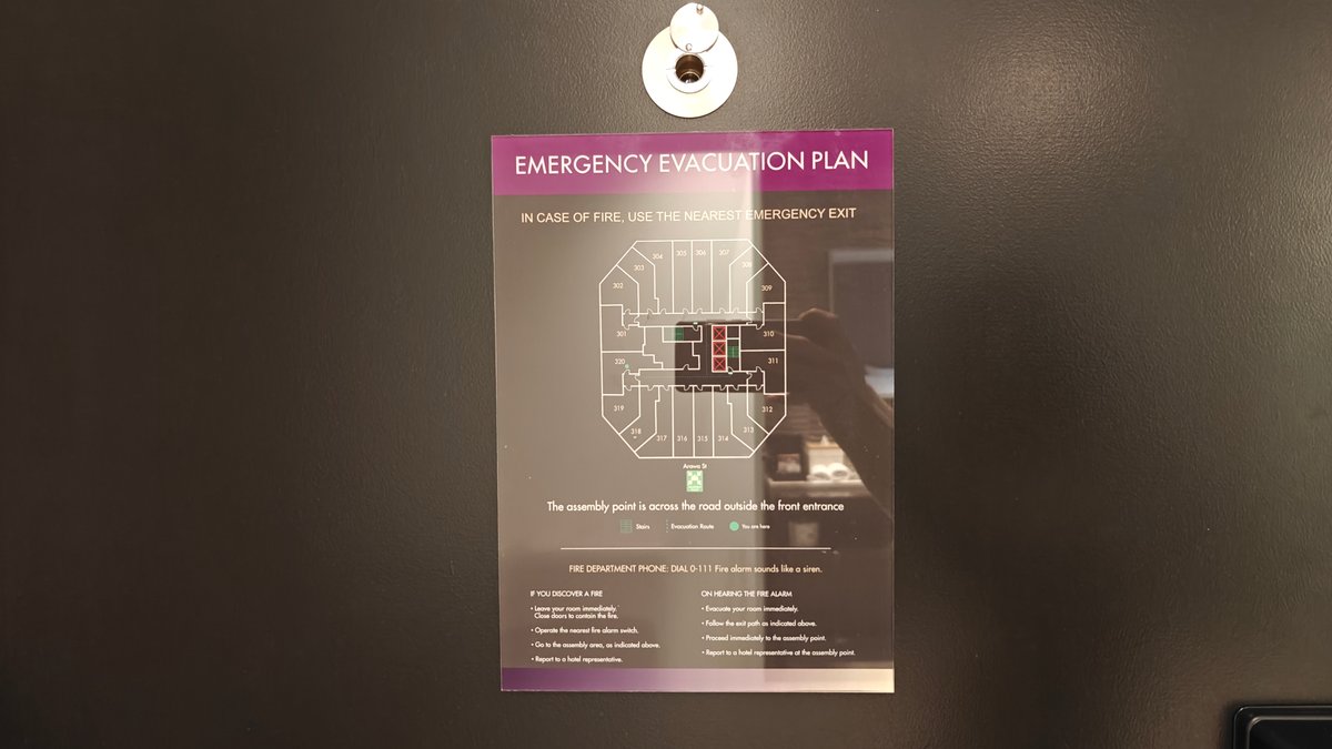 The emergency evacuation plan mounted on the back