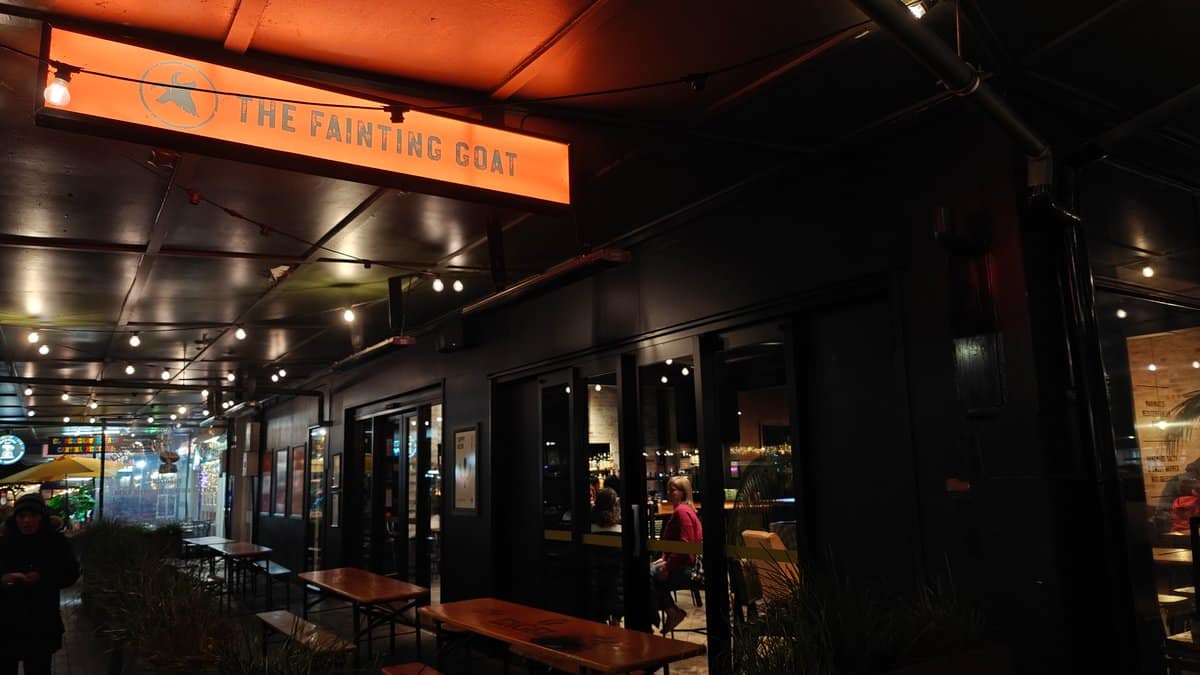 The Fainting Goat lit at night
