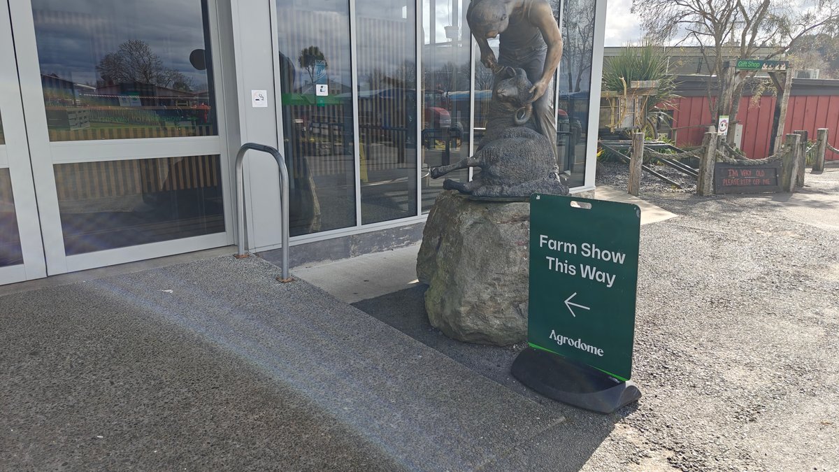 The glass entrance doors with a Farm Show
