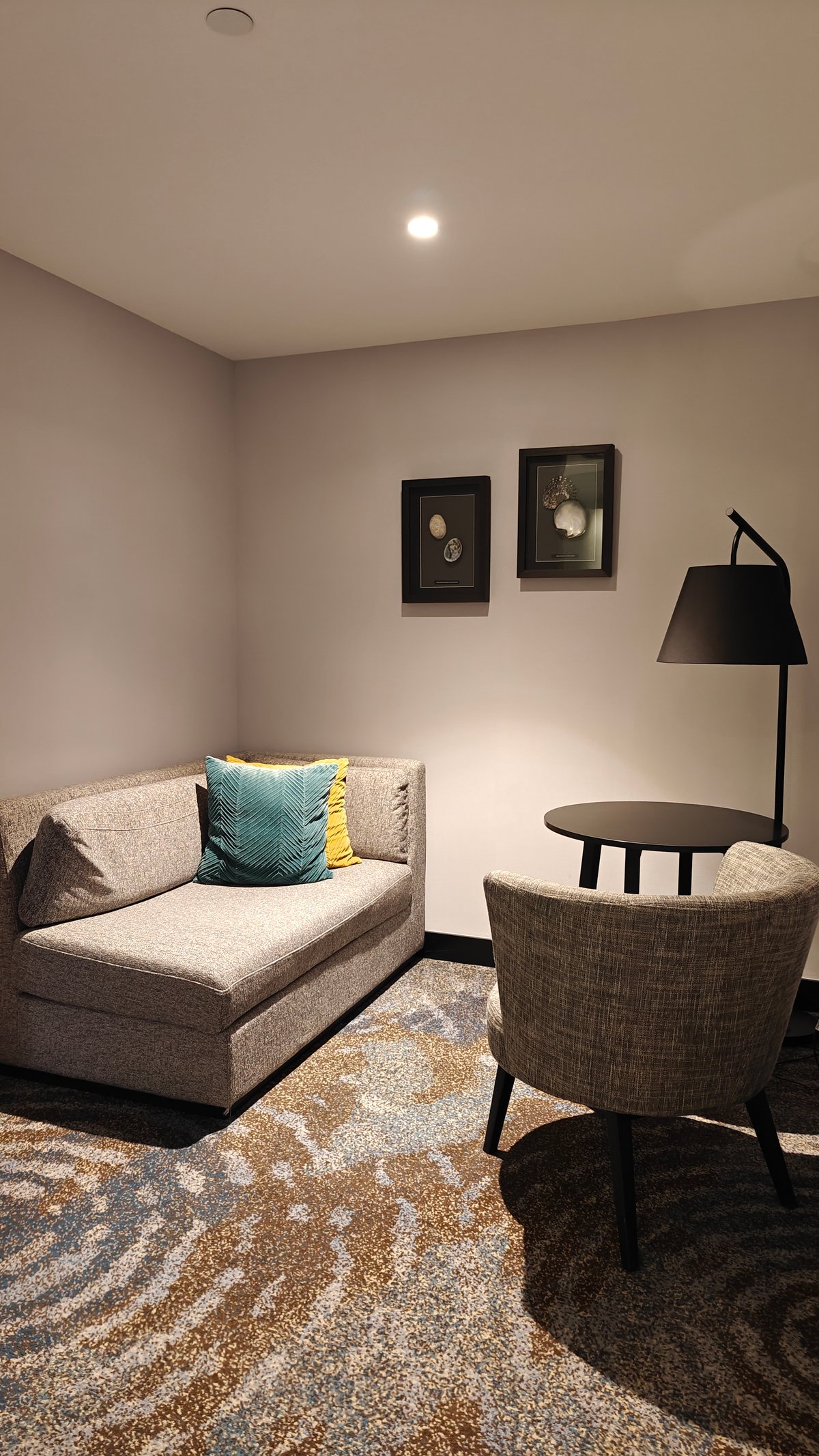 The guest room seating — a long upholstered