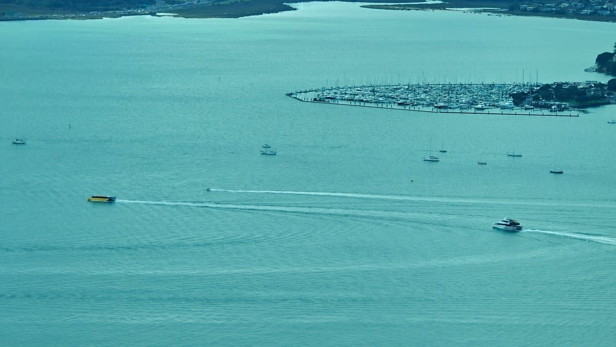 The harbour with a ferry drawing a long