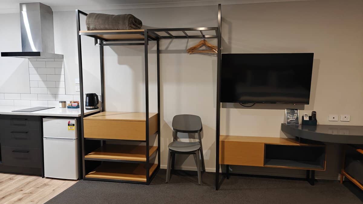 The kitchenette with the bunk frame and the
