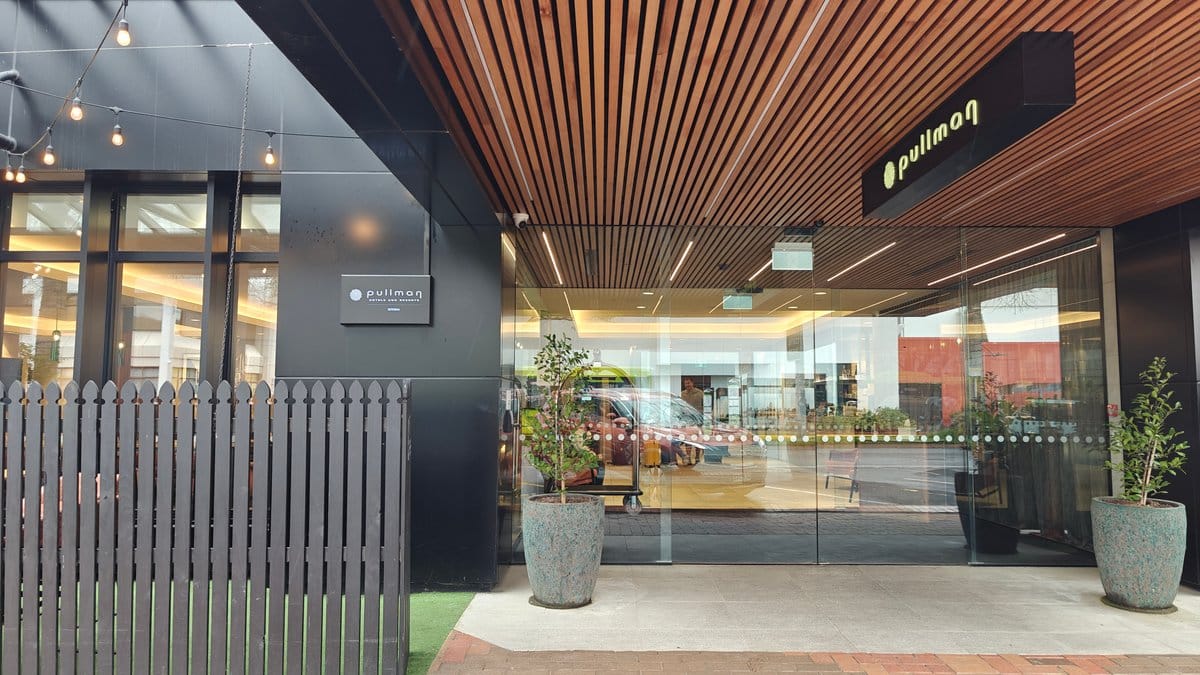 The lobby under its timber-slatted ceiling looking through