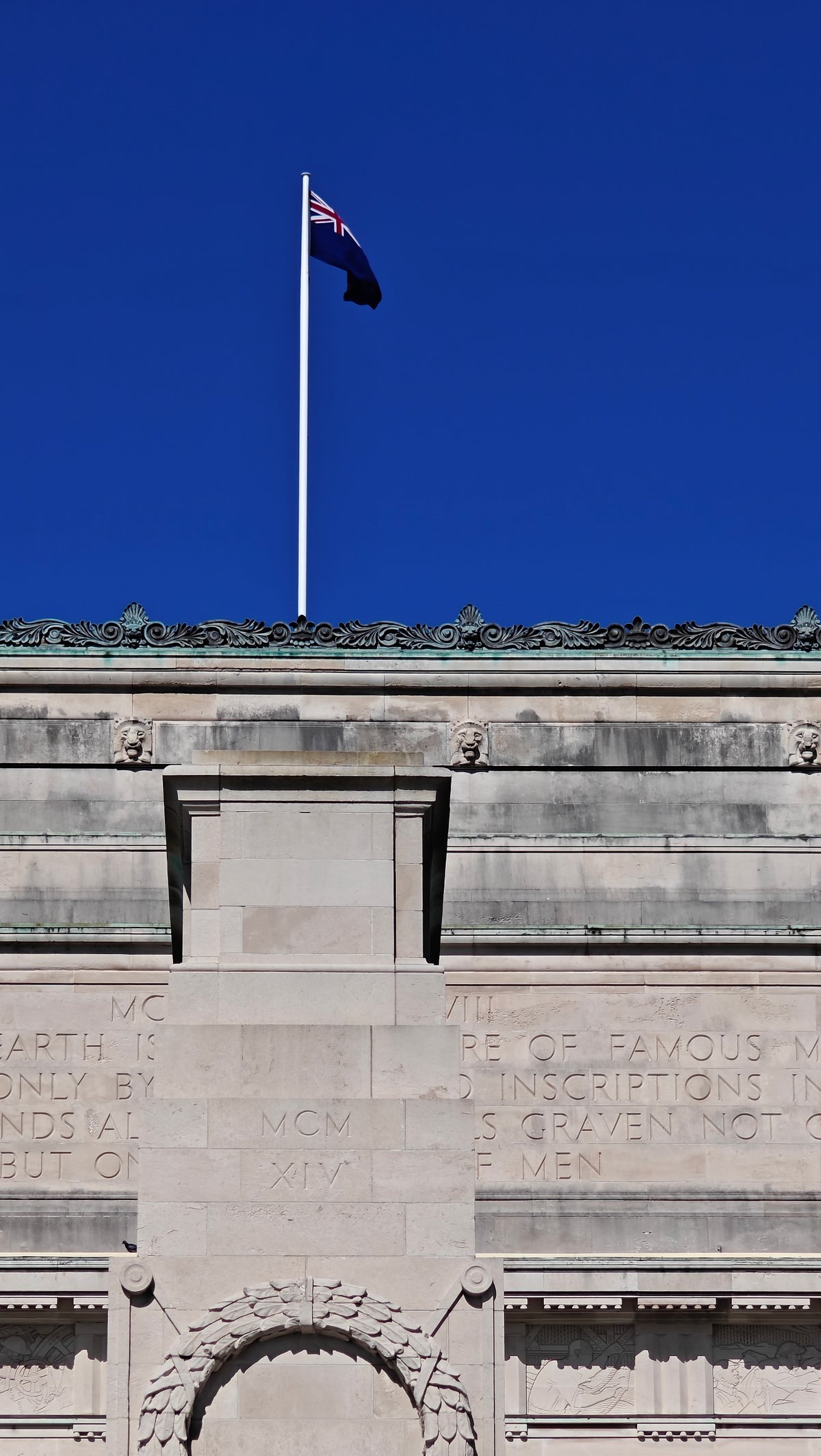 The New Zealand flag flying against a deep