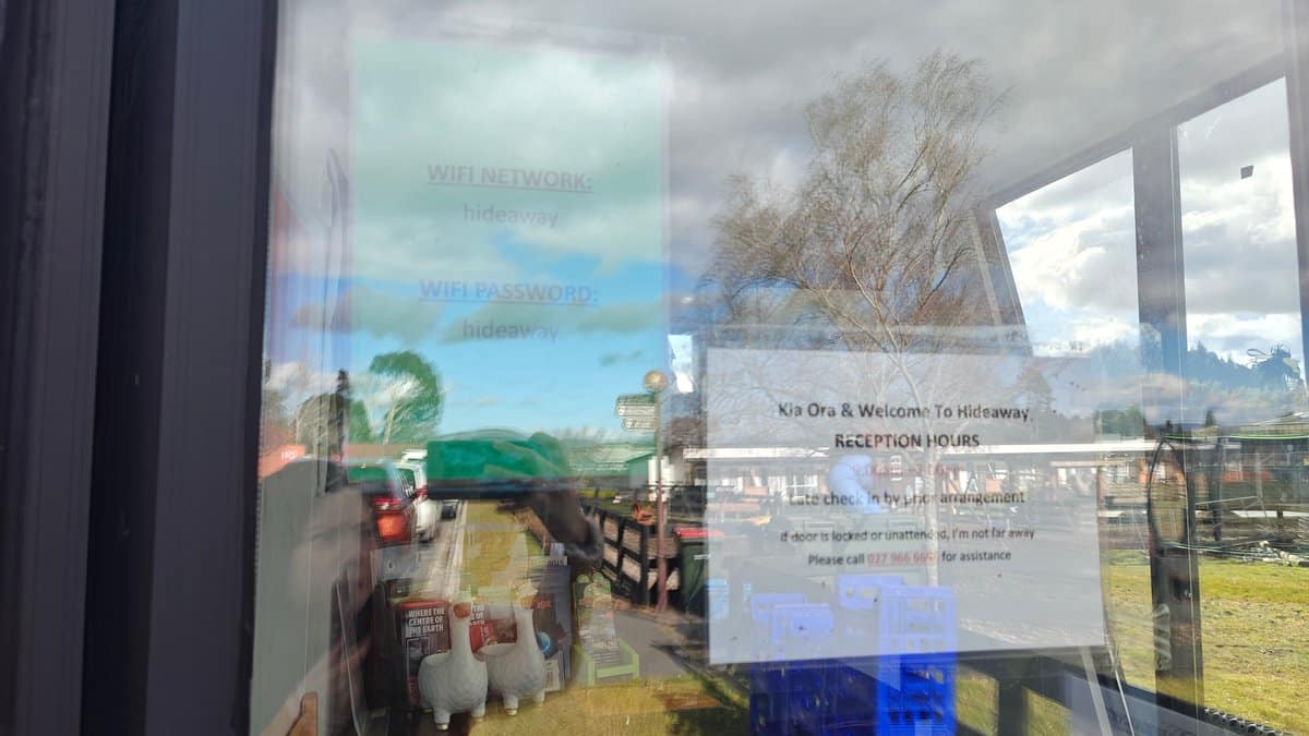 The office window with printed notices taped inside