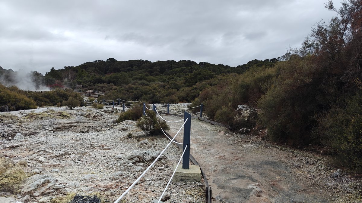 The path with rope rail curving between the