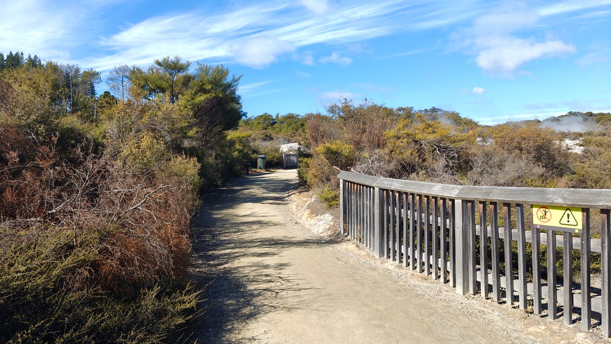 The path with the fence running along the