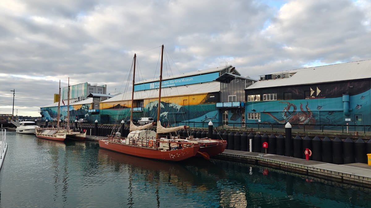 The red vessel with the blue shed and