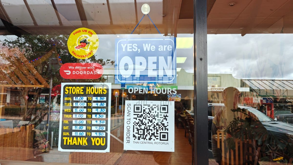 The shopfront window with an OPEN sign, a