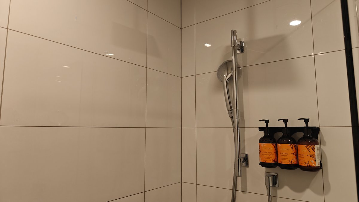 The shower with the dispensers mounted on the