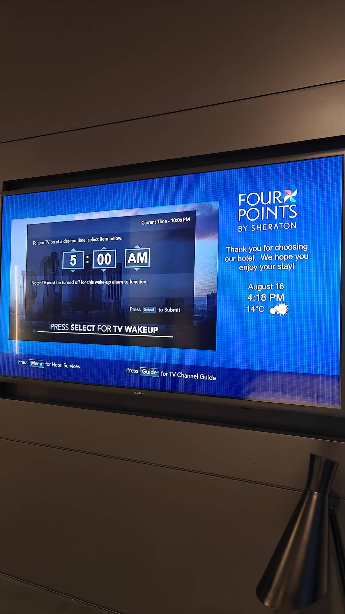 The television showing the hotel's welcome screen.