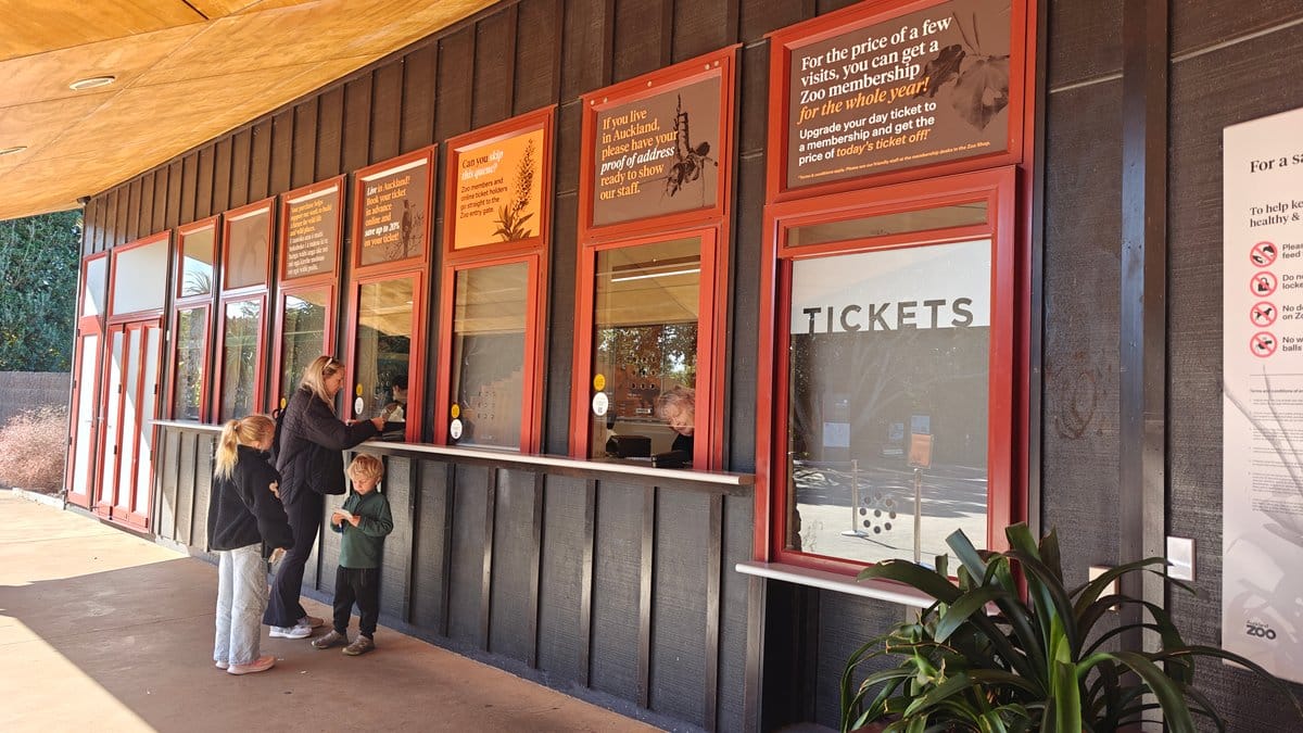 The ticket windows with visitors queueing under the