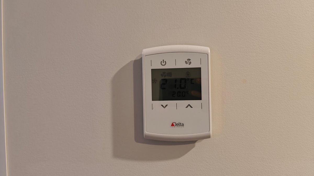 The wall-mounted climate control panel.