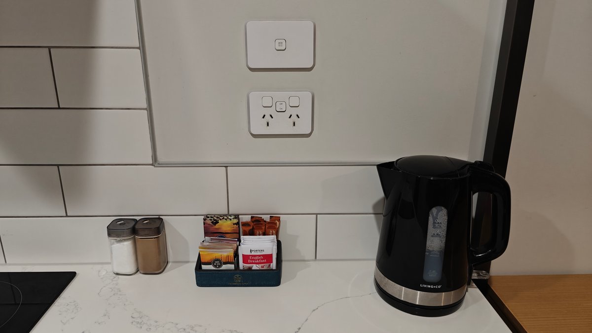 The wall socket with the kettle and the