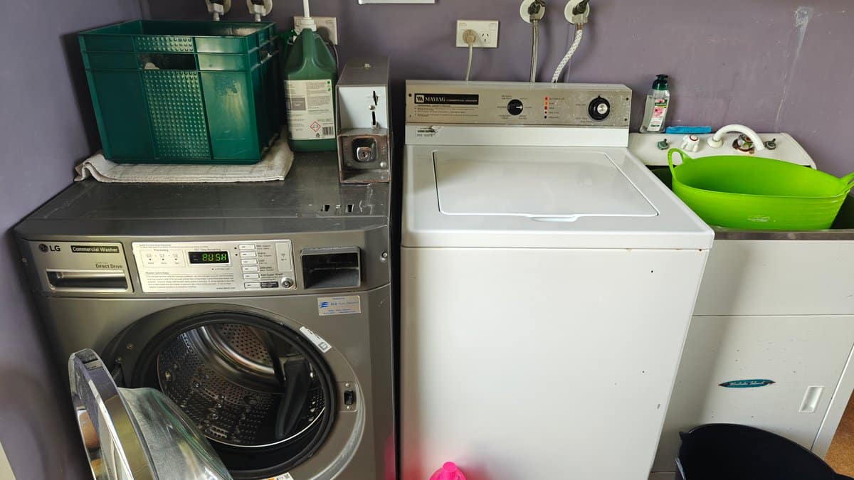 The washer and dryer with baskets and detergent