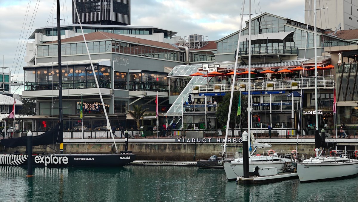 The waterfront frontage with an explore charter yacht