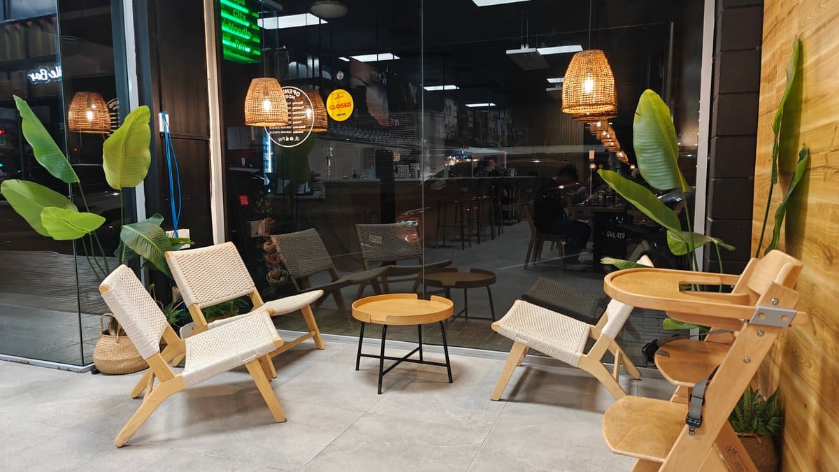 Timber seating under warm pendants