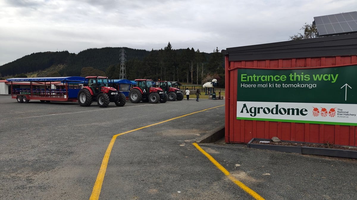 Tractors and trailers in the yard with an