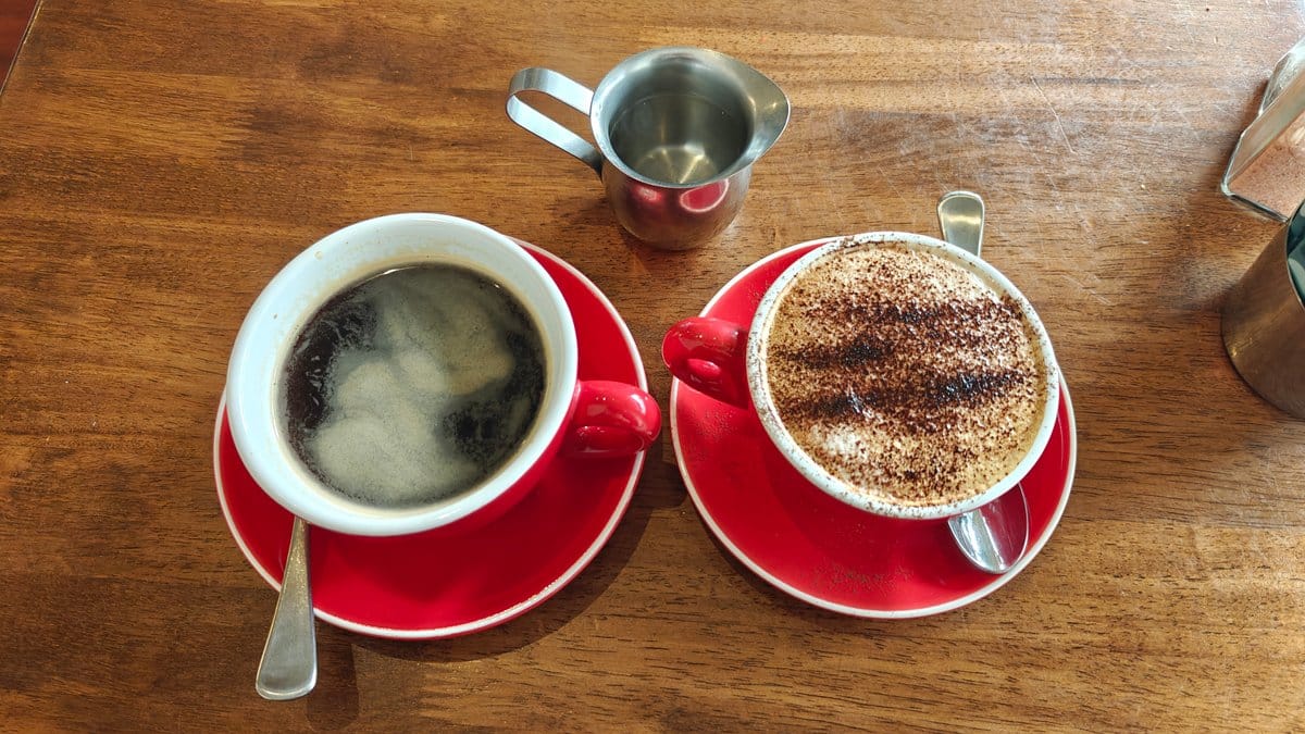 Two coffees in red cups