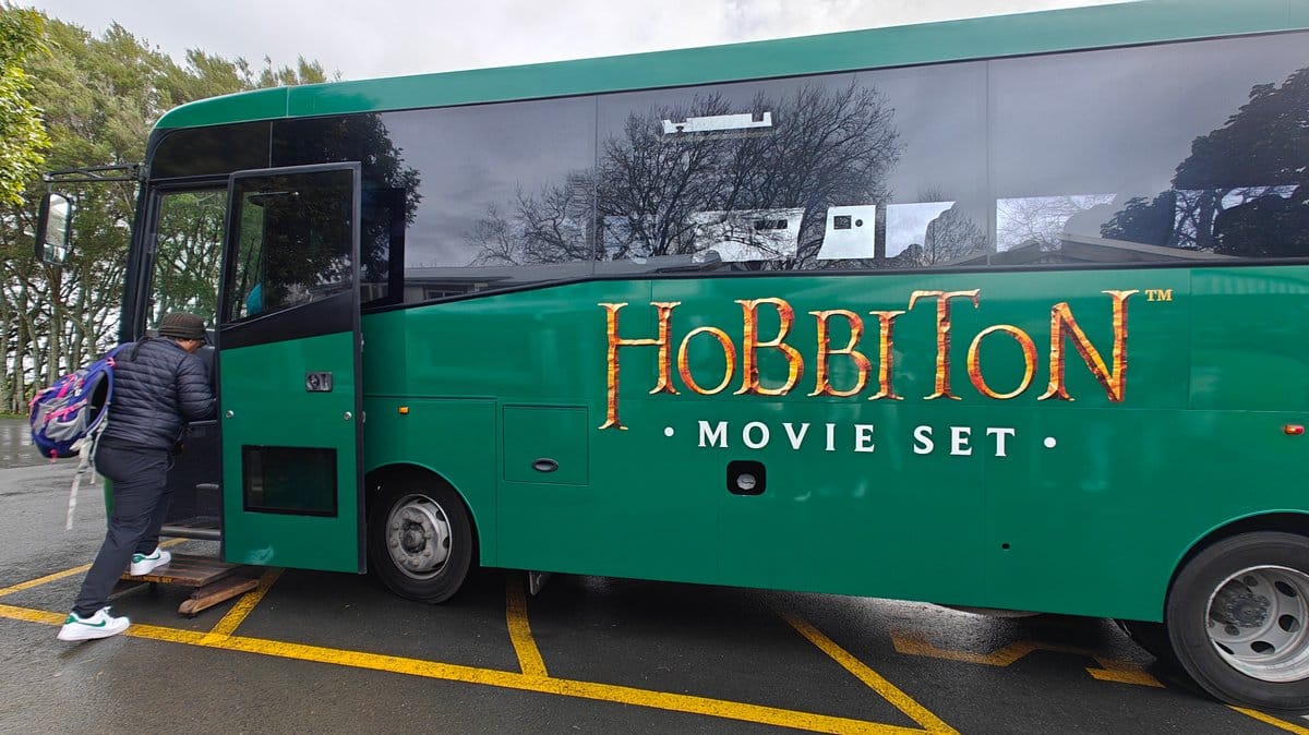 Visitors boarding the Hobbiton bus at the departure