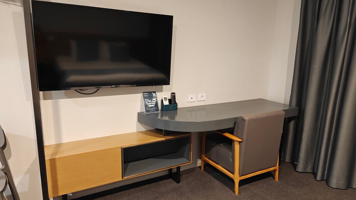 Wall-mounted television above the desk
