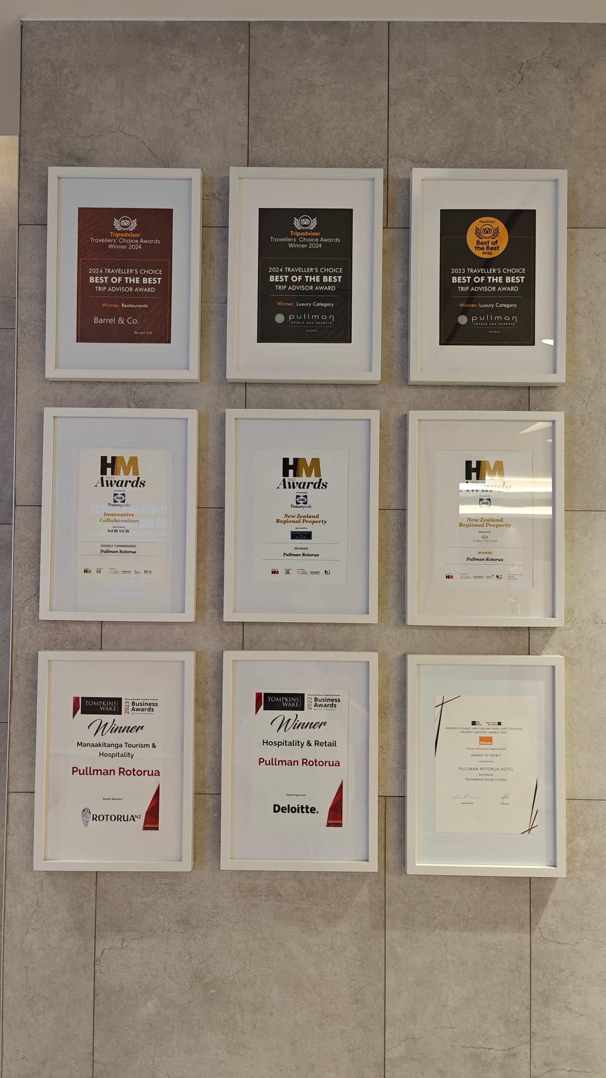 Wall of hotel awards and certificates