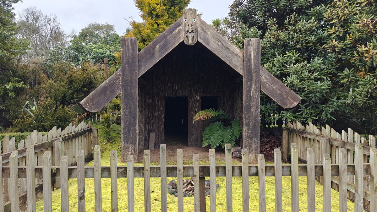 Whare with carved bargeboards