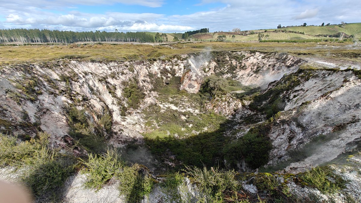 Wide crater with white-streaked walls
