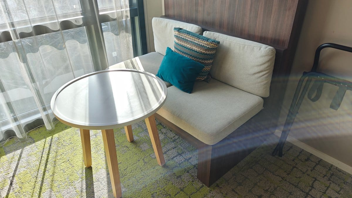 Window seat with teal cushion