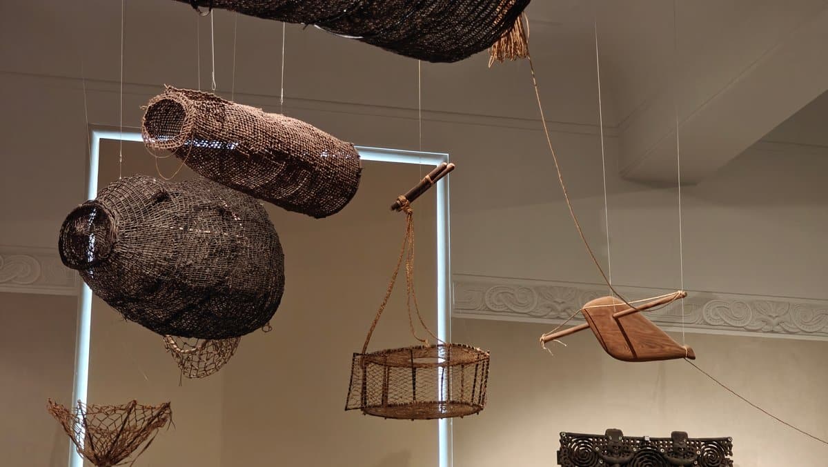 Woven eel traps hanging from ceiling