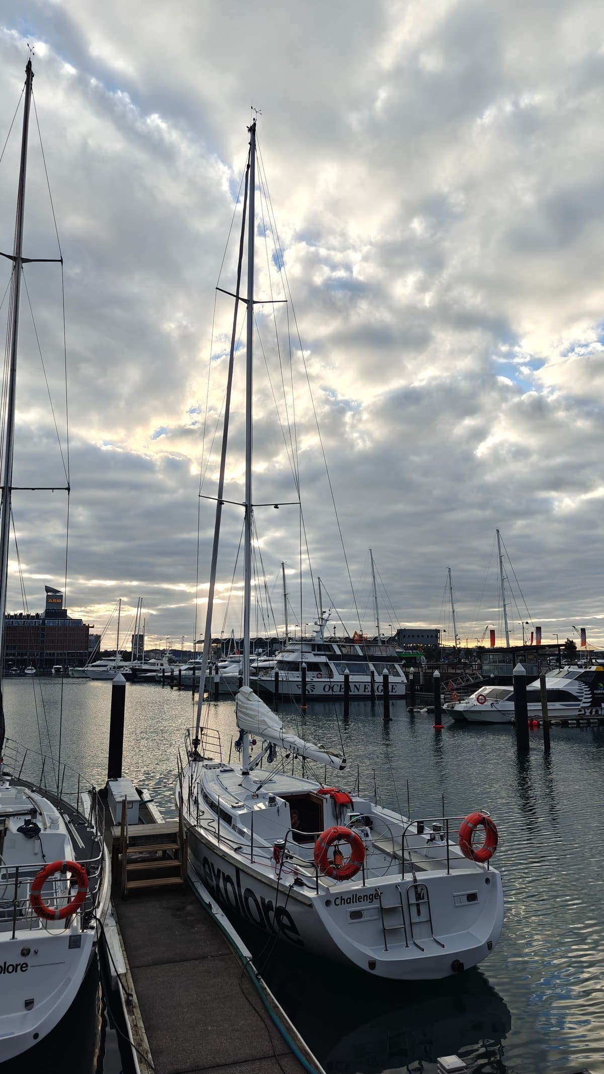 Yacht masts against grey sky
