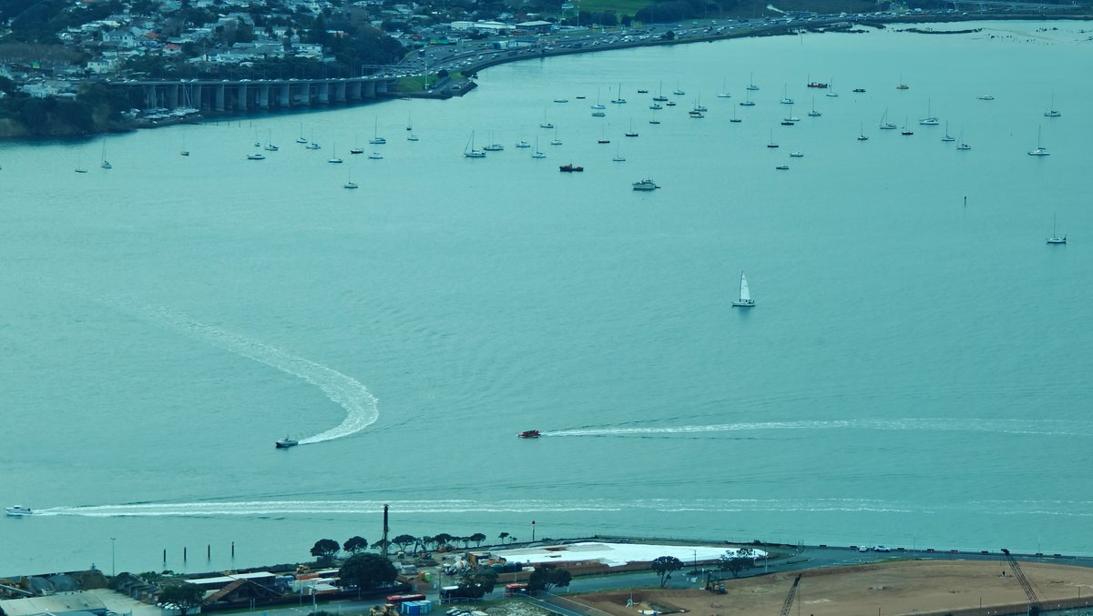 Yachts moored out on the harbour in the